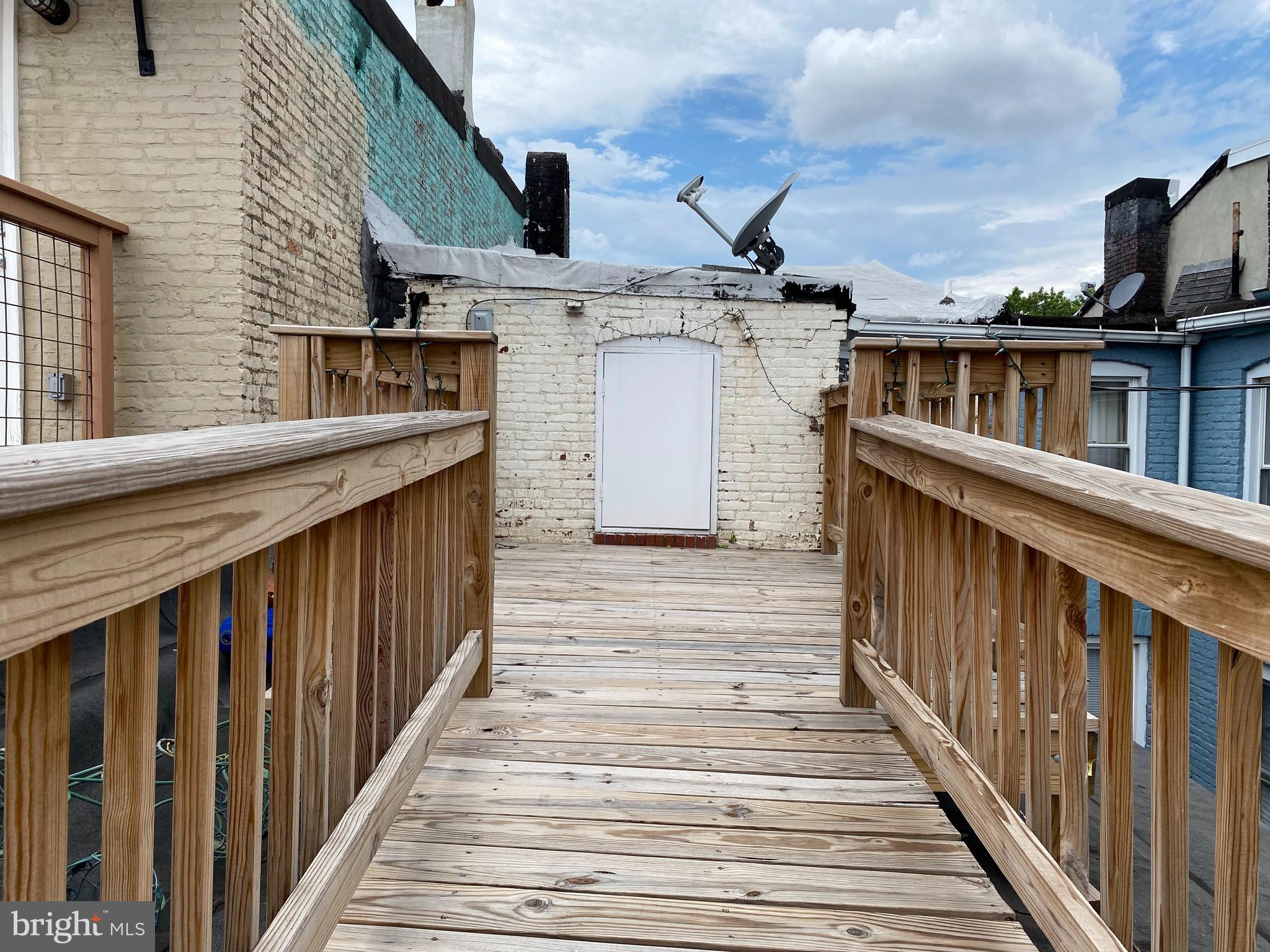 229 South Ann Street, Unit B Baltimore, MD 21231 - Photo 42 of 47 a view of a house with wooden deck