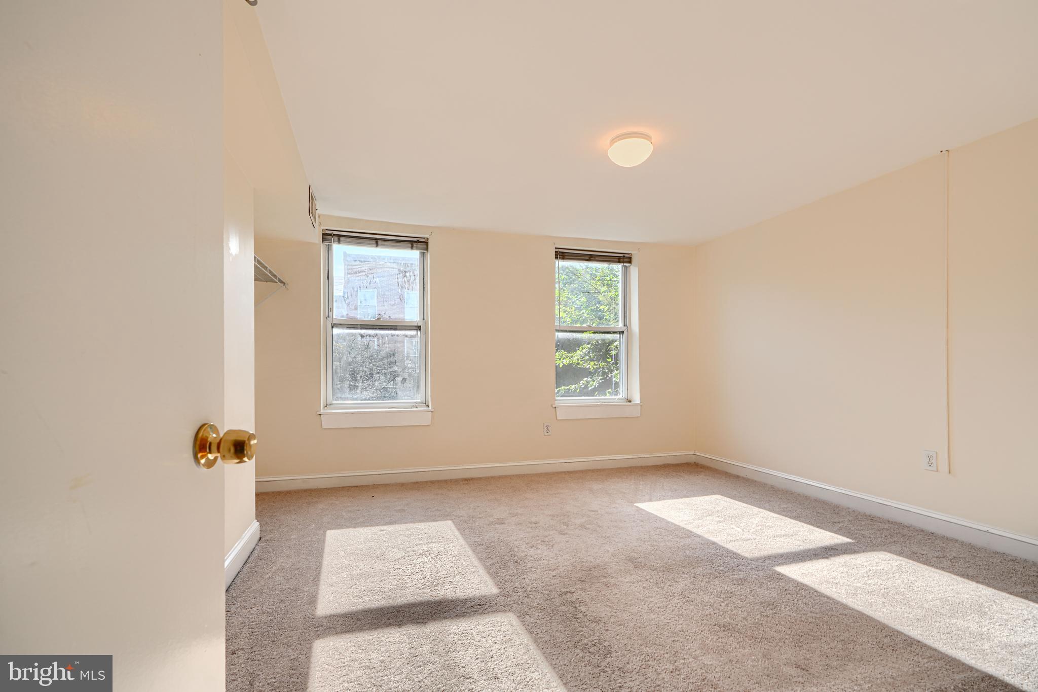 229 South Ann Street, Unit B Baltimore, MD 21231 - Photo 10 of 47 an empty room with windows