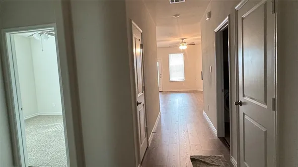a view of a bathroom from a hallway