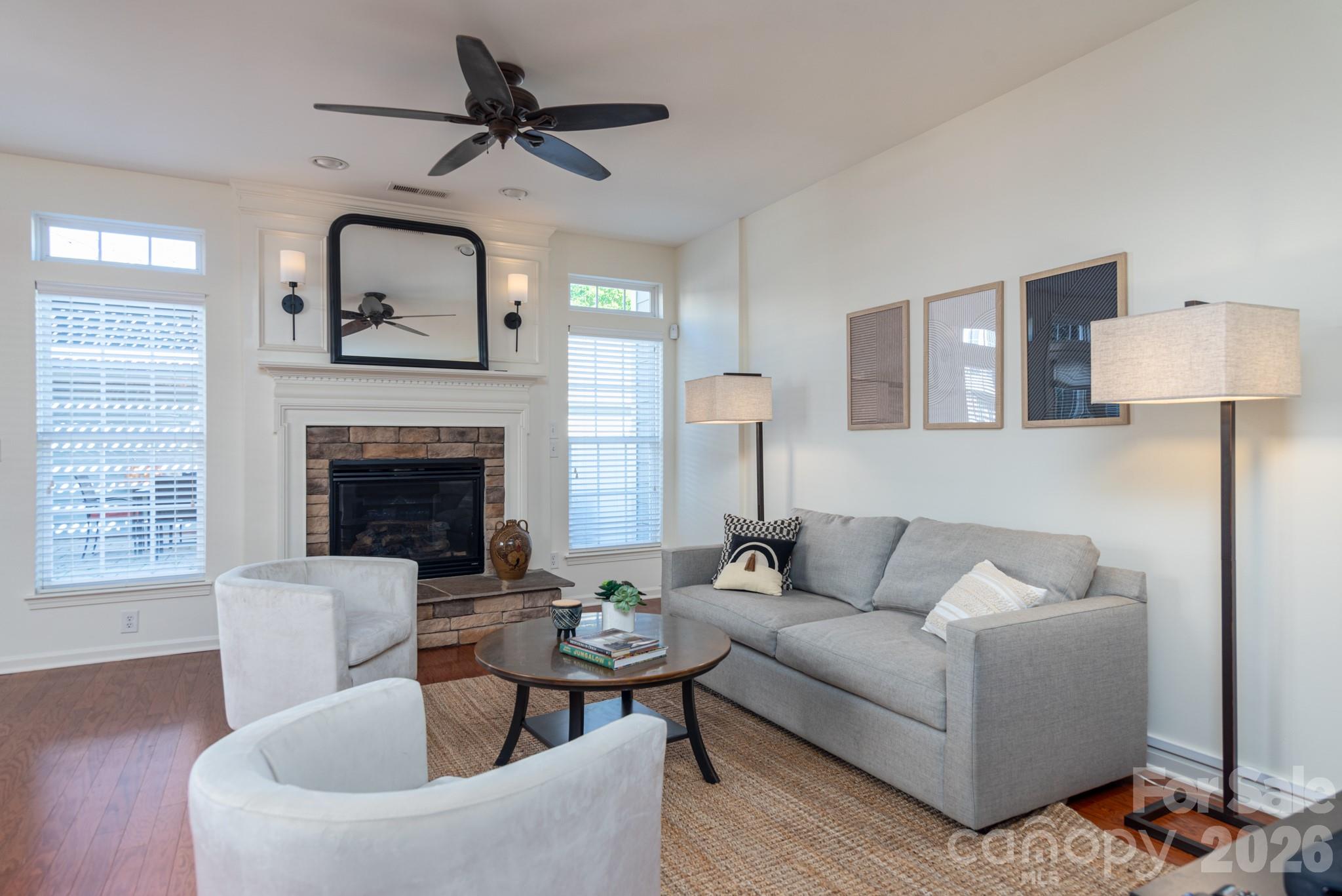 438 Magnolia Street Davidson, NC 28036 - Photo 11 of 20 a living room with furniture and a fireplace
