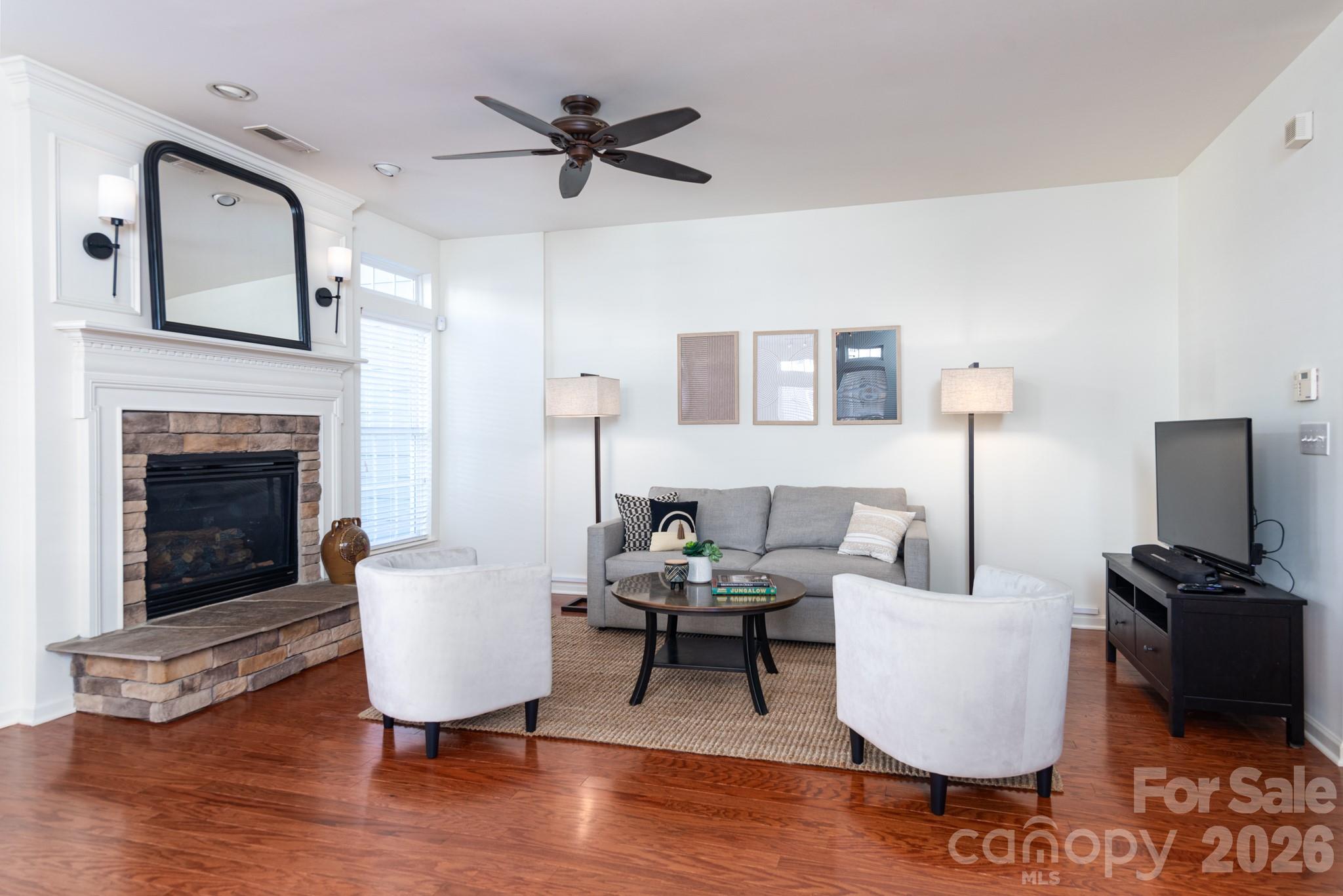 438 Magnolia Street Davidson, NC 28036 - Photo 12 of 20 a living room with furniture and a fireplace