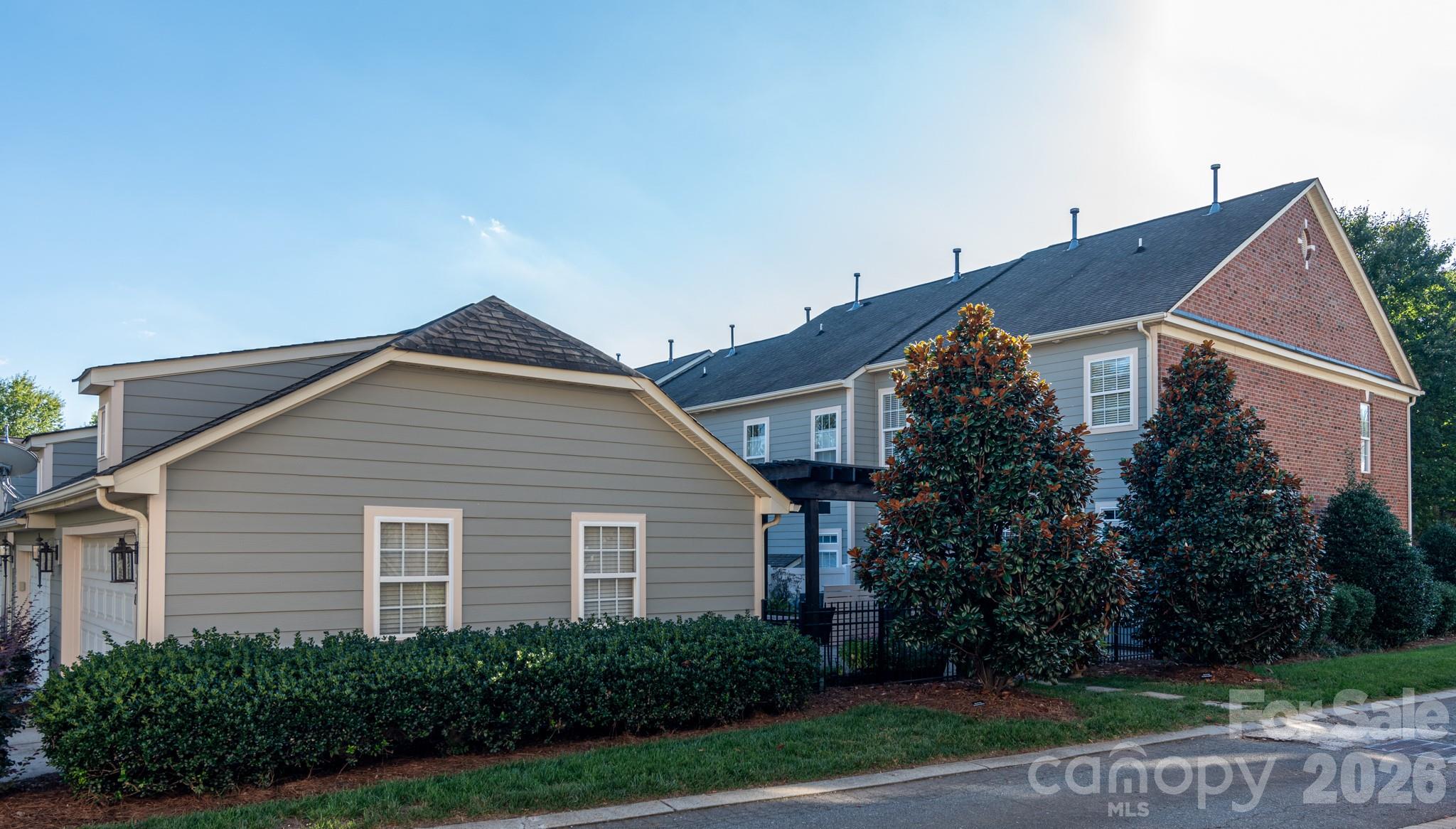 438 Magnolia Street Davidson, NC 28036 - Photo 20 of 20 a view of a house with a yard