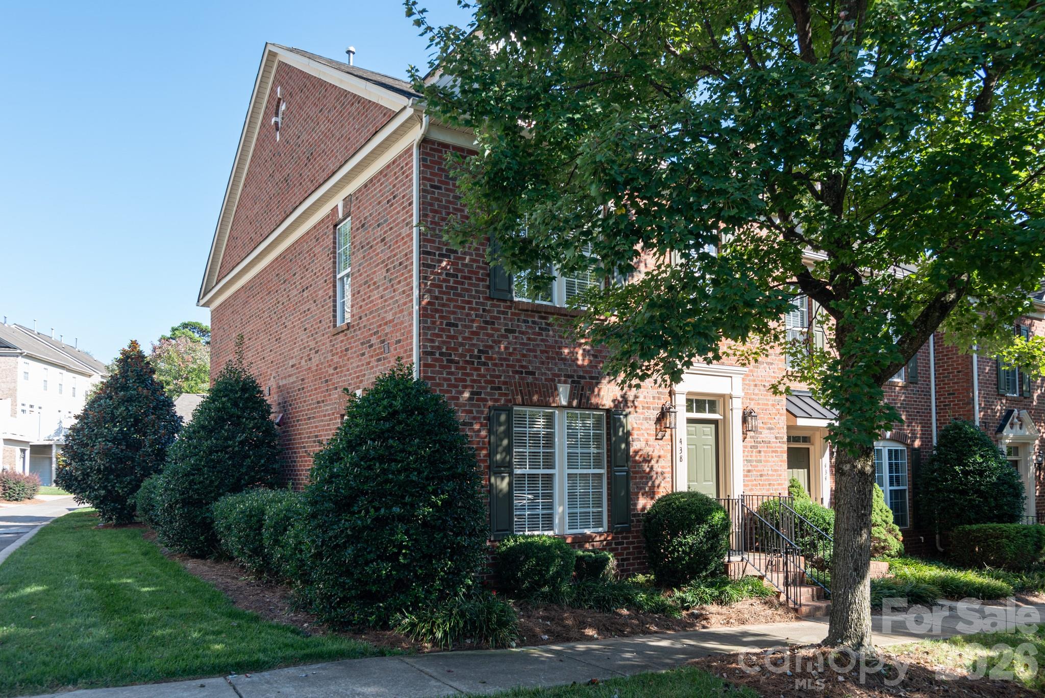 438 Magnolia Street Davidson, NC 28036 - Photo 2 of 20 a front view of a house with garden