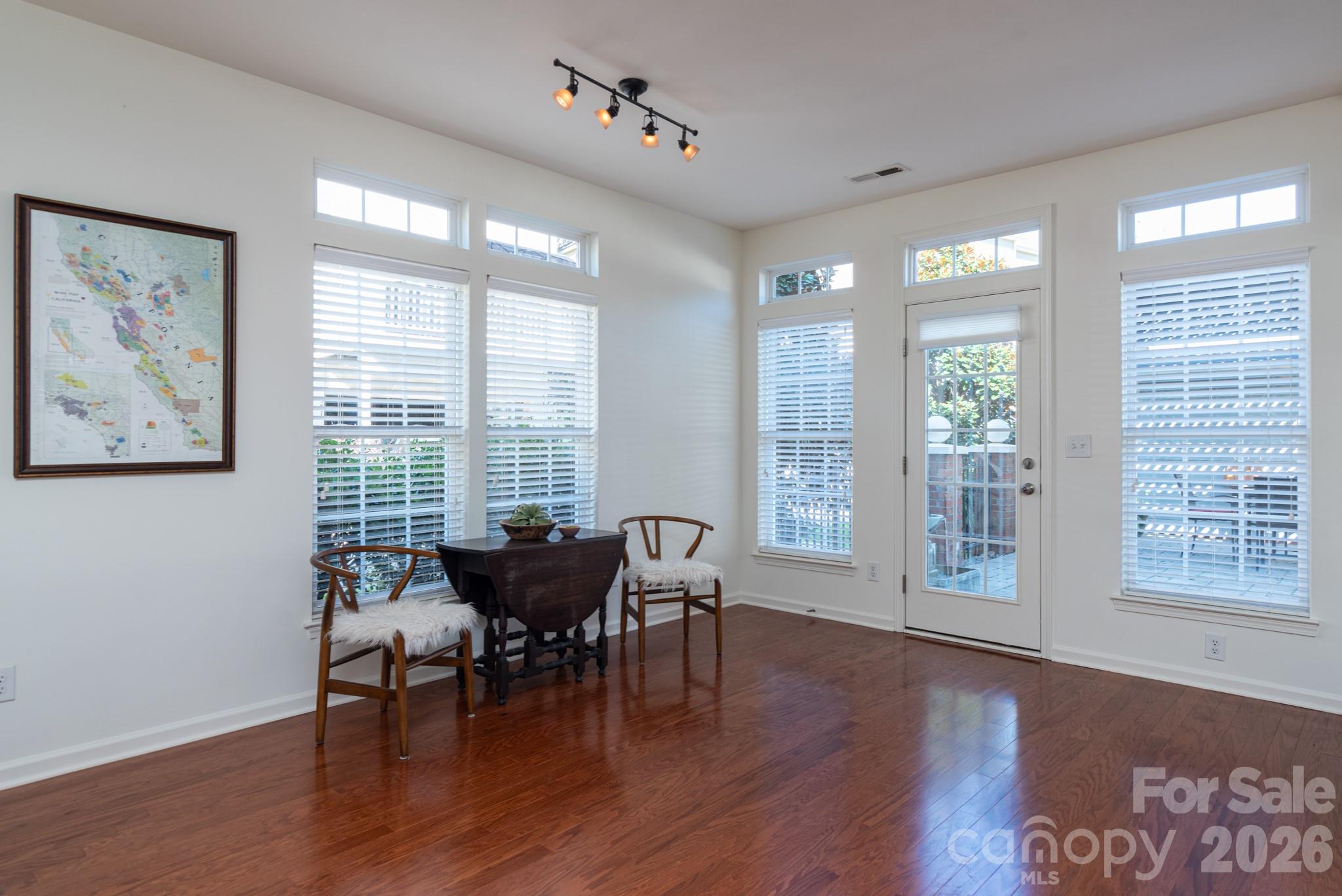 438 Magnolia Street Davidson, NC 28036 - Photo 10 of 20 a living room with furniture and wooden floor