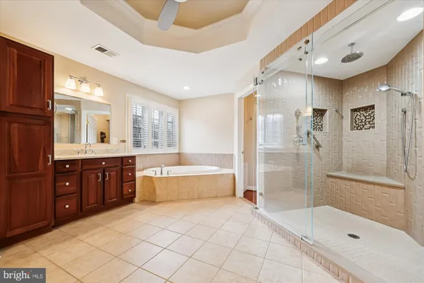 a bathroom with a granite countertop sink a toilet and a mirror