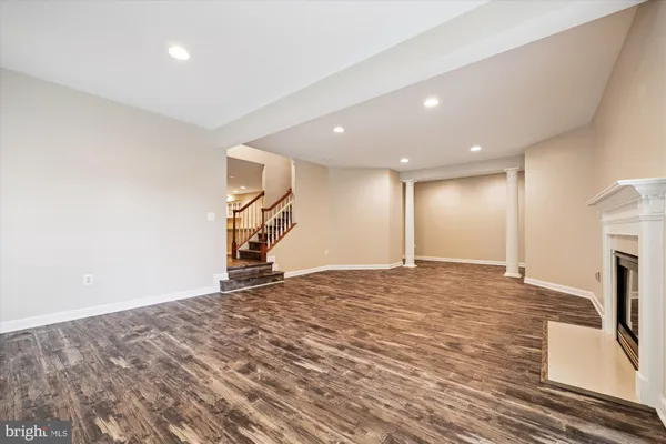 a front view of a house with a garden and deck