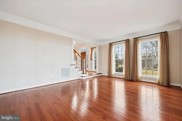 a open kitchen with stainless steel appliances granite countertop a sink a stove and a wooden floors