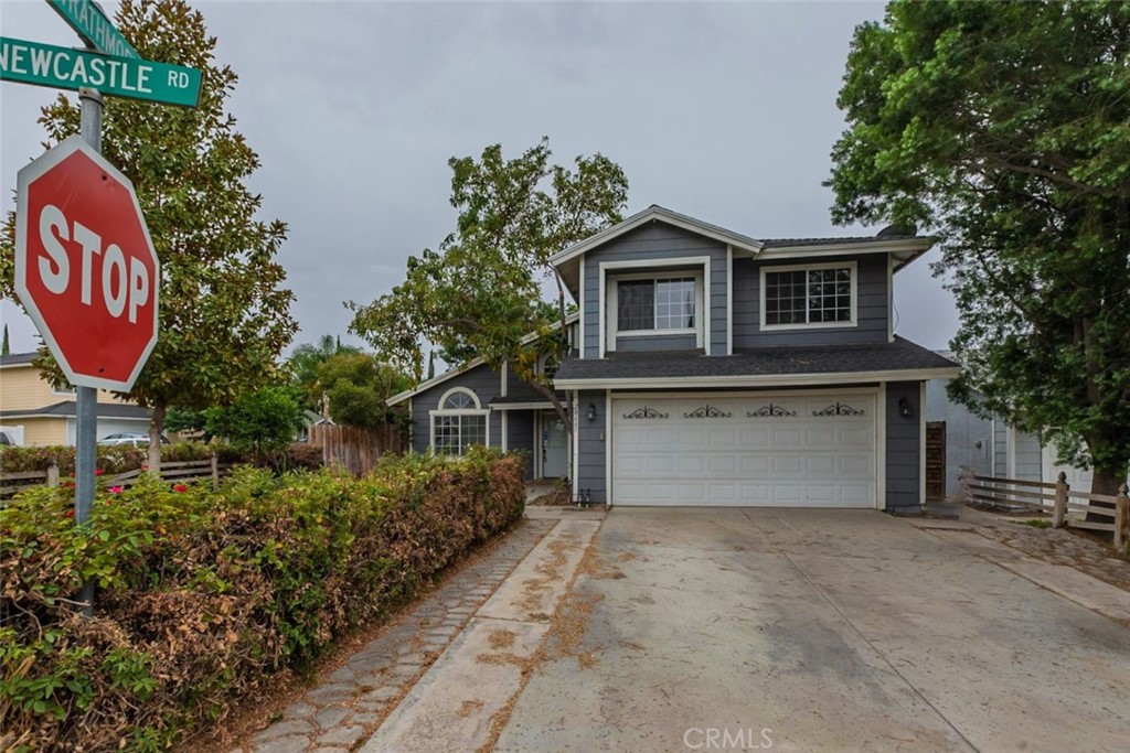 28665 Newcastle Road Highland, CA 92346 - Photo 1 of 1 a front view of a house with garden
