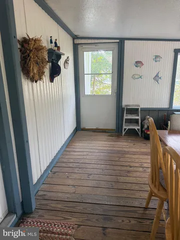 a view of a hallway with a window