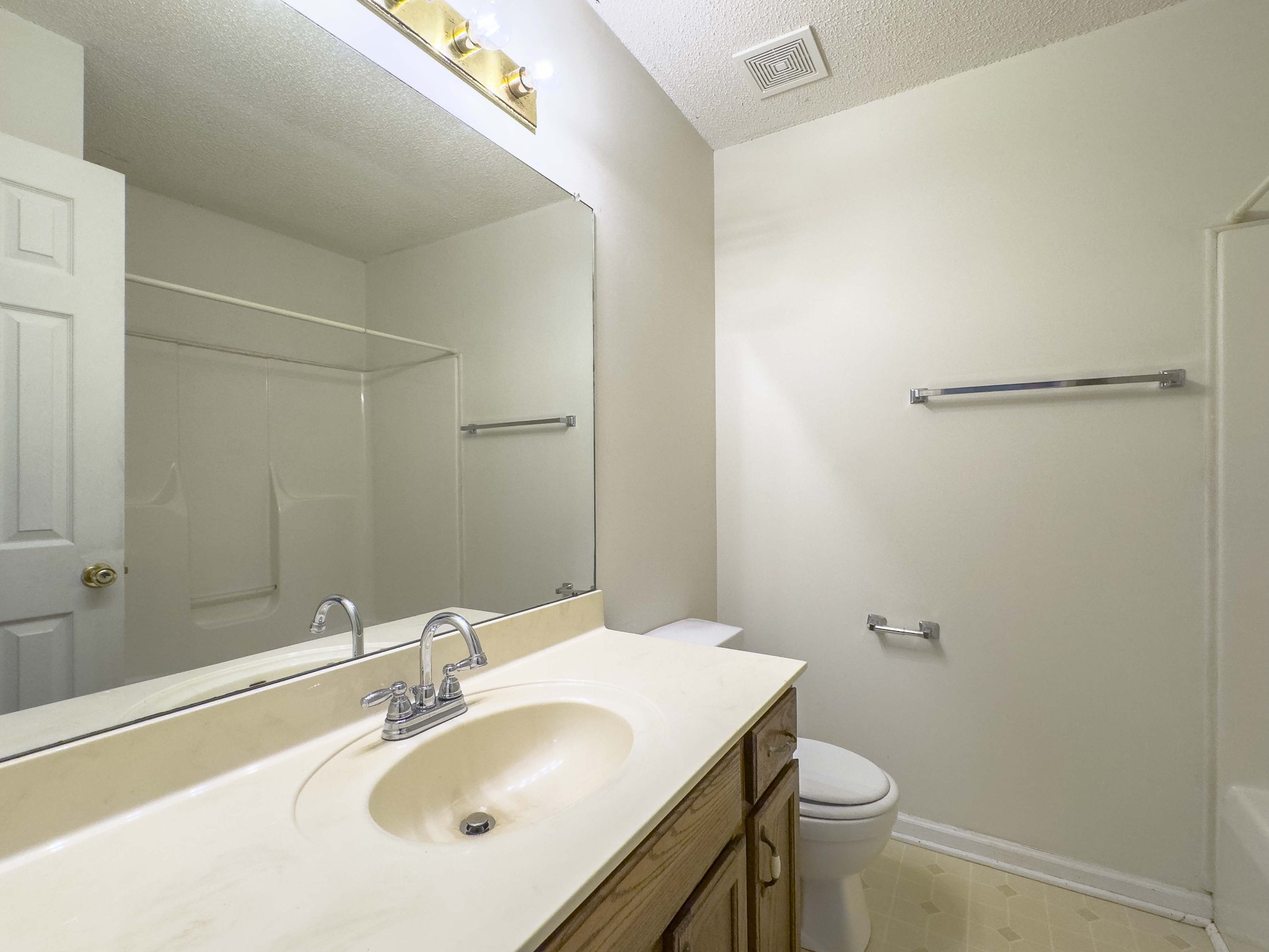 108 Hickory Trace Road, Unit 2 Clarksville, TN 37040 - Photo 16 of 22 a bathroom with a sink toilet and a mirror