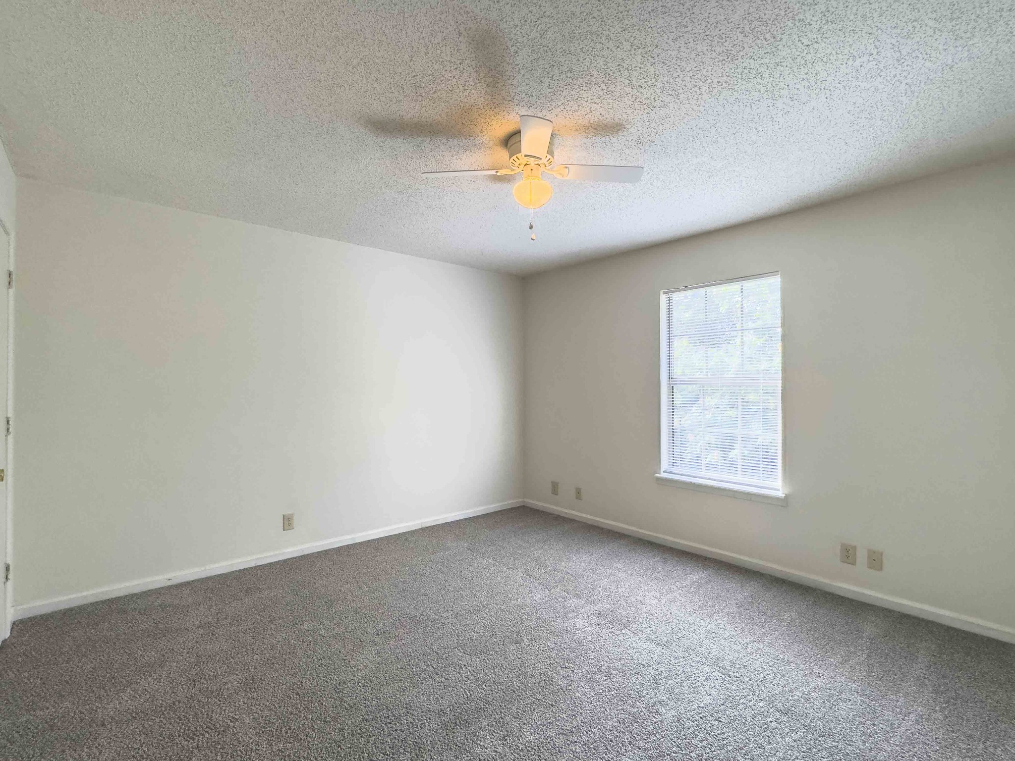 108 Hickory Trace Road, Unit 2 Clarksville, TN 37040 - Photo 18 of 22 an empty room with a window and a fan
