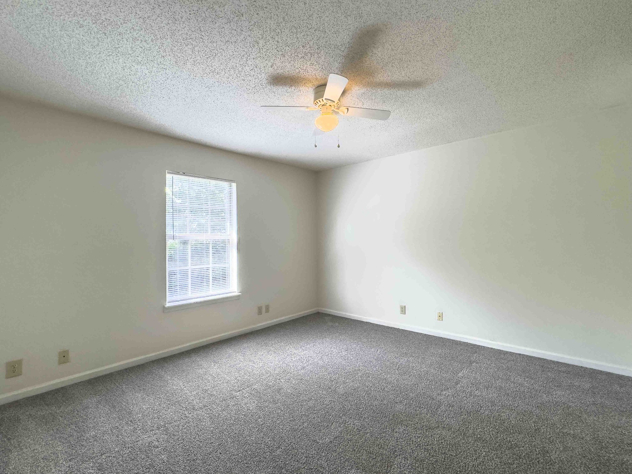 108 Hickory Trace Road, Unit 2 Clarksville, TN 37040 - Photo 21 of 22 an empty room with a window and a fan