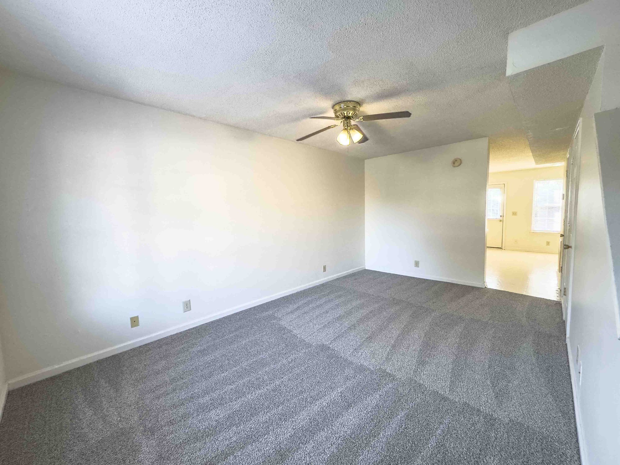 108 Hickory Trace Road, Unit 2 Clarksville, TN 37040 - Photo 3 of 22 an empty room with a empty space and a ceiling fan