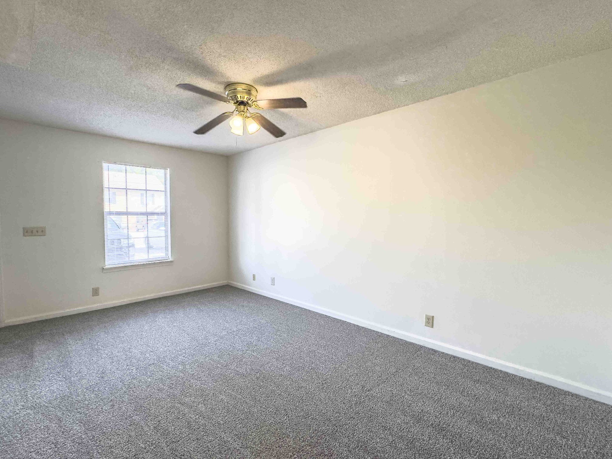 108 Hickory Trace Road, Unit 2 Clarksville, TN 37040 - Photo 6 of 22 an empty room with windows and fan