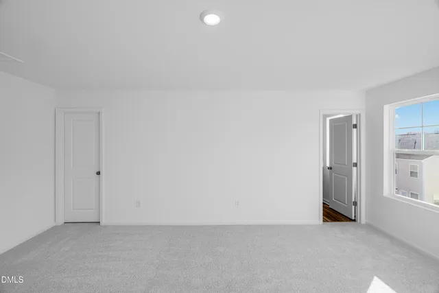 a bathroom with a double vanity sink toilet mirror and shower