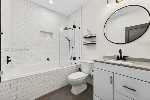 a bathroom with a toilet a sink and a bathtub