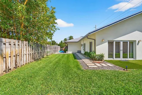 a front view of a house with a yard and porch