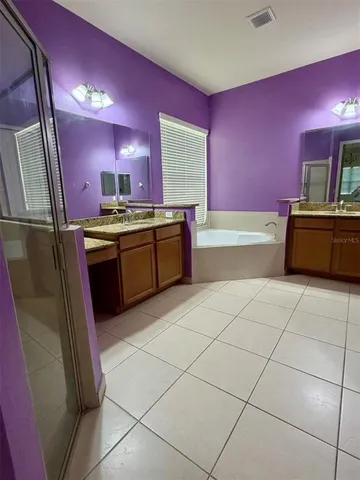 a kitchen with stainless steel appliances a sink stove and cabinets