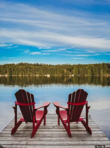a sitting area with view of lake