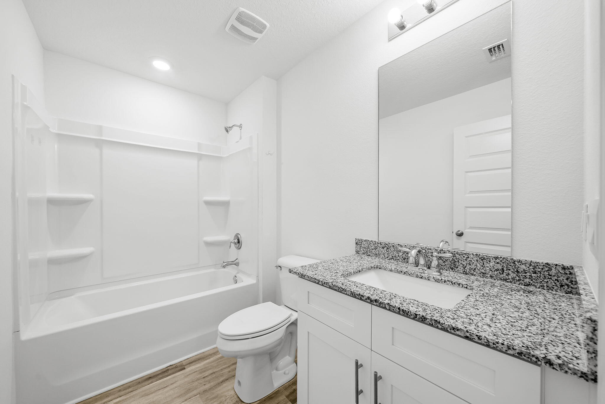 39 Riverwalk Crossing Freeport, FL 32439 - Photo 22 of 32 a bathroom with a granite countertop sink toilet and shower