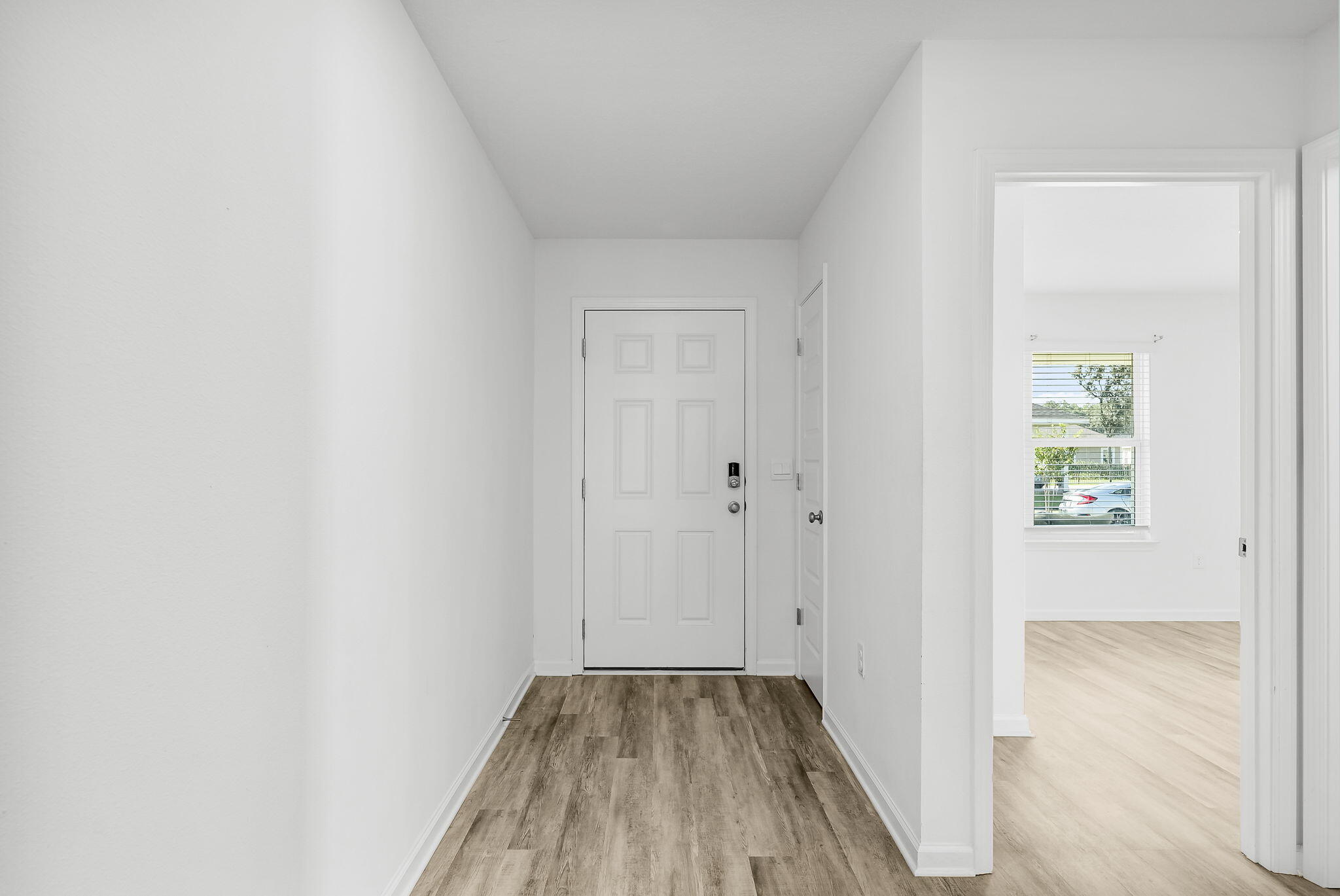 39 Riverwalk Crossing Freeport, FL 32439 - Photo 4 of 32 a view of a hallway with wooden floor
