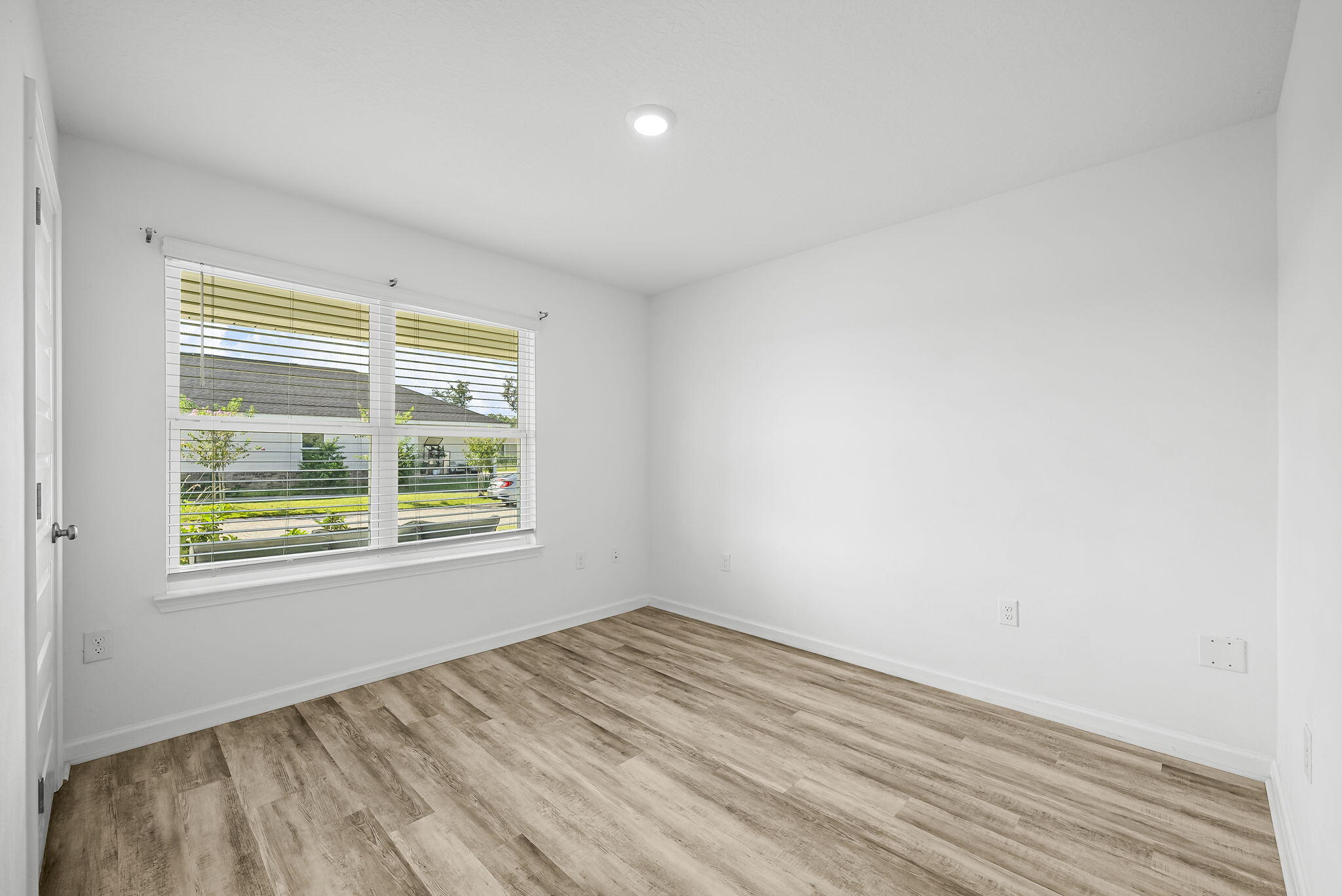 39 Riverwalk Crossing Freeport, FL 32439 - Photo 5 of 32 a view of an empty room with wooden floor and a window