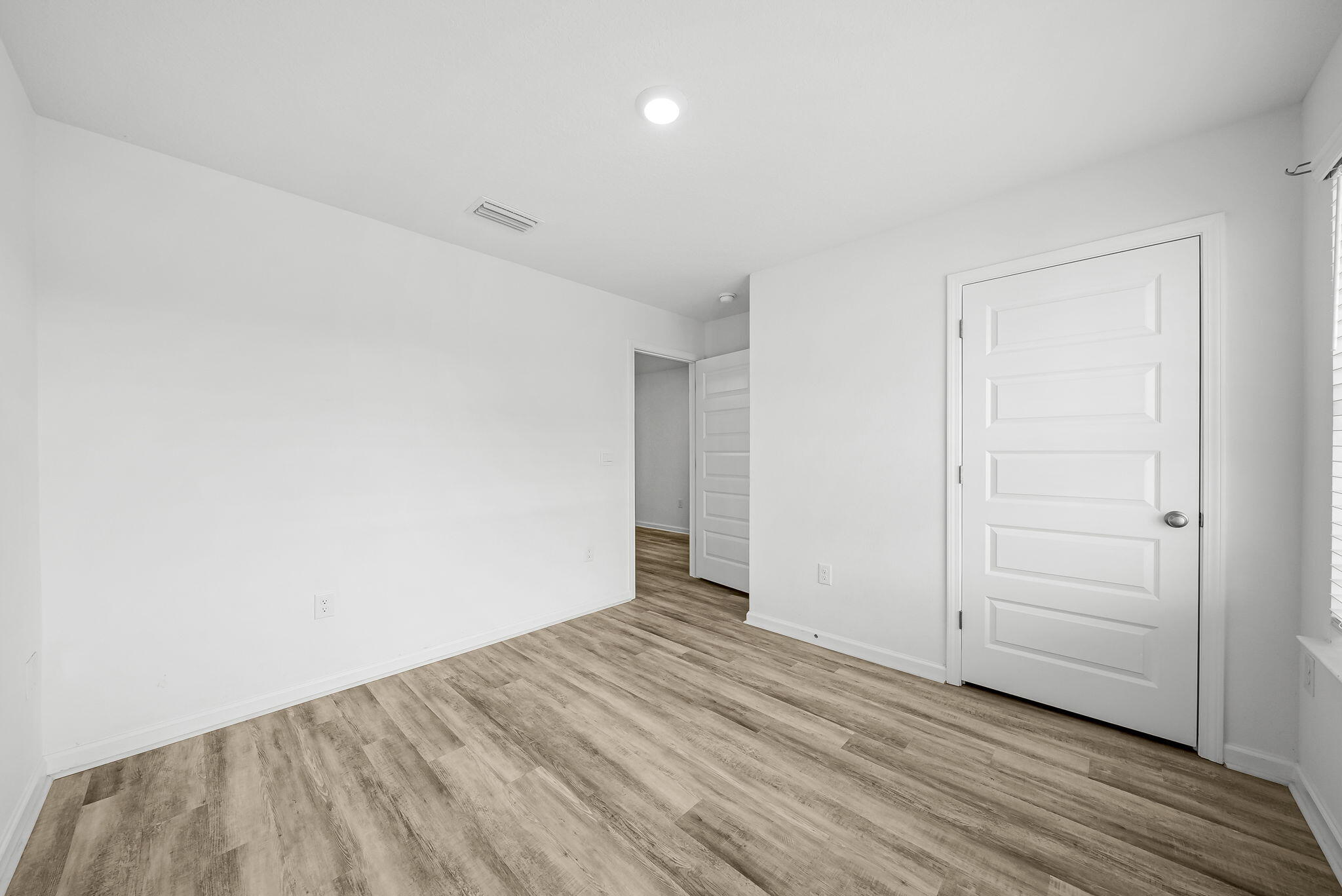 39 Riverwalk Crossing Freeport, FL 32439 - Photo 6 of 32 an empty room with wooden floor