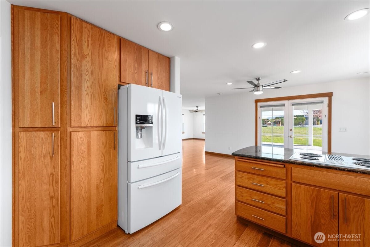 1190 Summit Boulevard Manson, WA 98831 - Photo 11 of 40 a kitchen with stainless steel appliances granite countertop a refrigerator and a sink