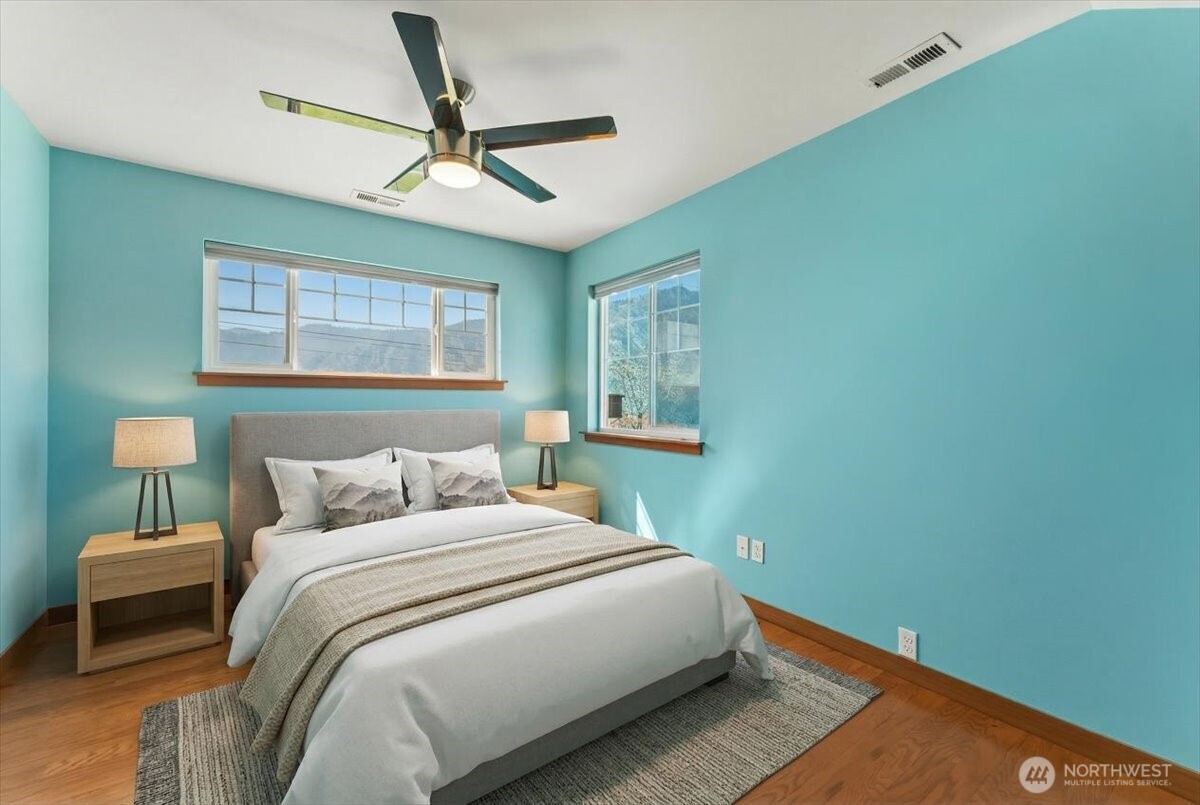 1190 Summit Boulevard Manson, WA 98831 - Photo 20 of 40 a bedroom with a bed and a window