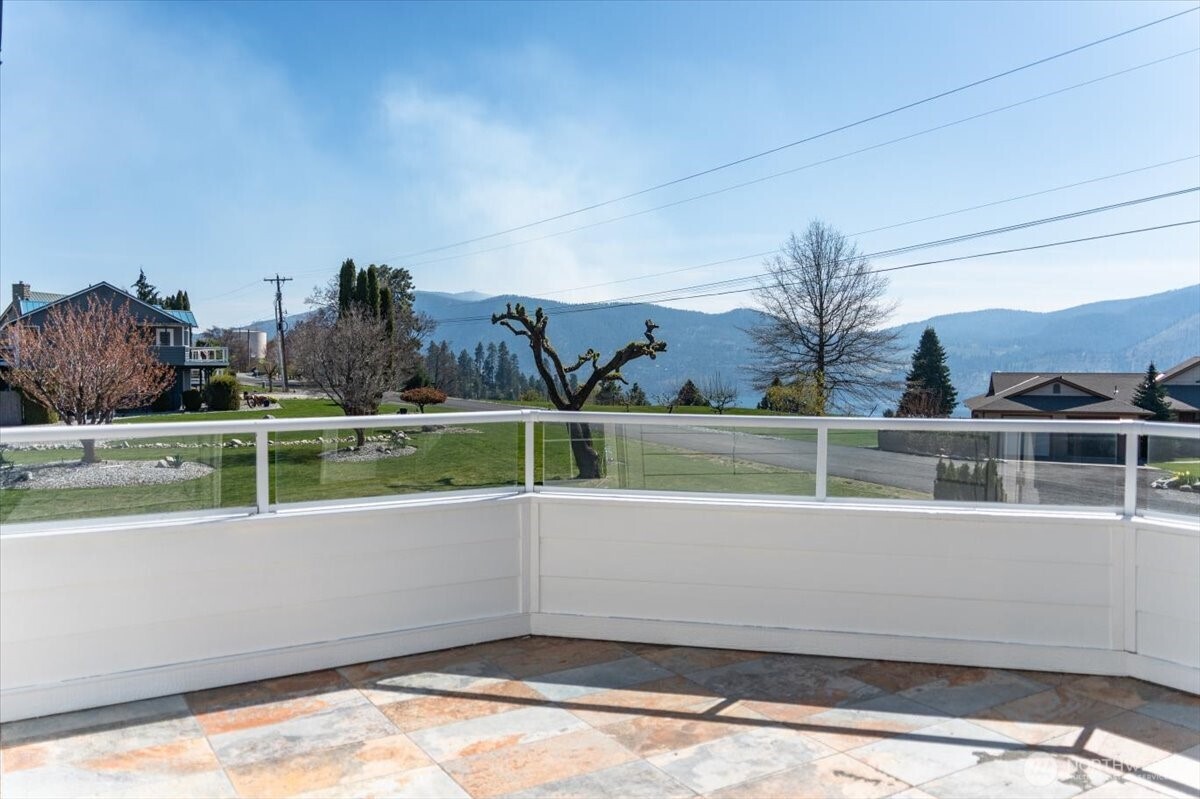 1190 Summit Boulevard Manson, WA 98831 - Photo 25 of 40 a view of a lake with a house in the background