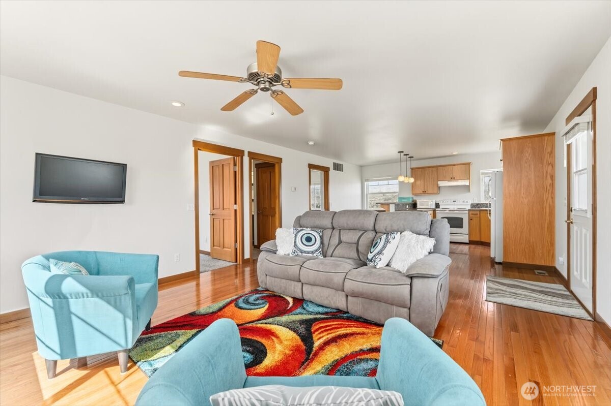 1190 Summit Boulevard Manson, WA 98831 - Photo 27 of 40 a living room with furniture and a flat screen tv