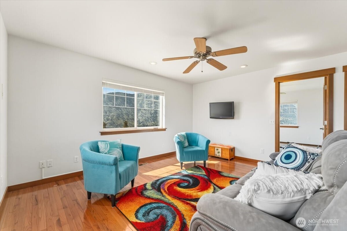 1190 Summit Boulevard Manson, WA 98831 - Photo 28 of 40 a living room with furniture and a window