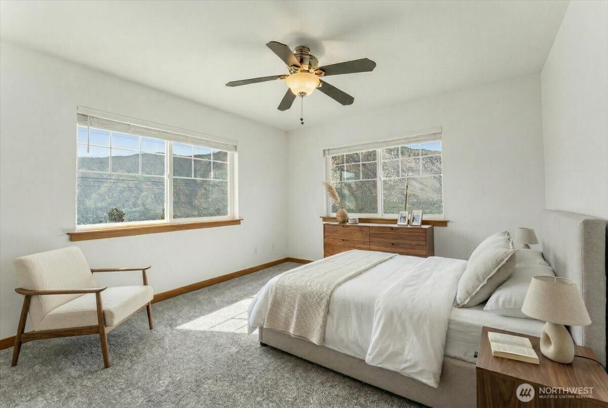 1190 Summit Boulevard Manson, WA 98831 - Photo 31 of 40 a bedroom with a bed and window