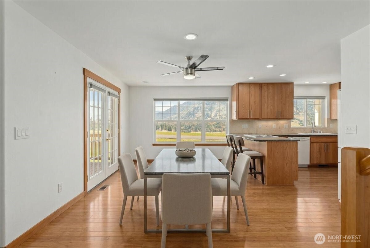 1190 Summit Boulevard Manson, WA 98831 - Photo 7 of 40 a view of a dining room with furniture window and wooden floor