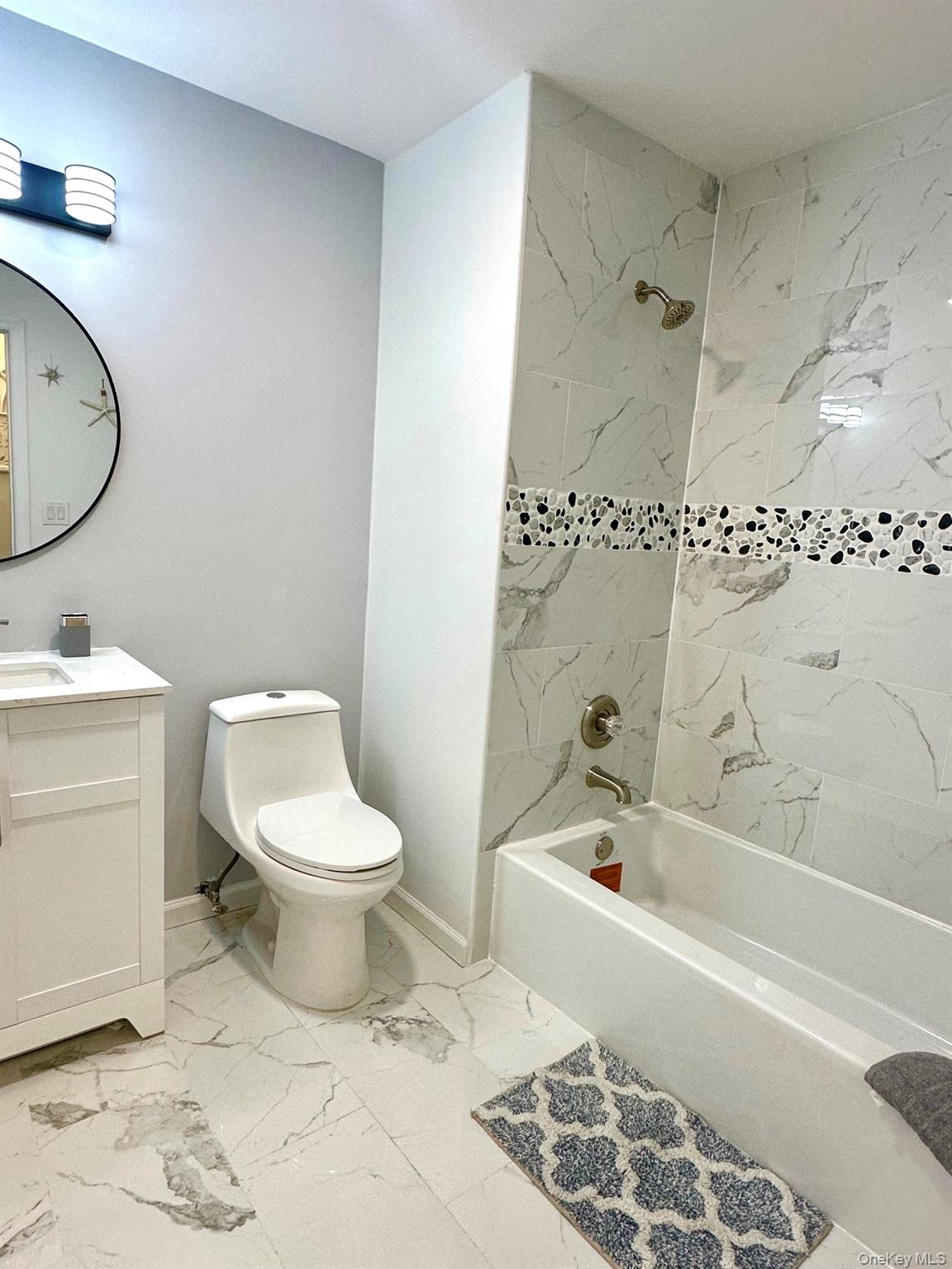 25 Clinton Street Middletown, NY 10940 - Photo 14 of 36 a bathroom with a toilet a sink and bathtub