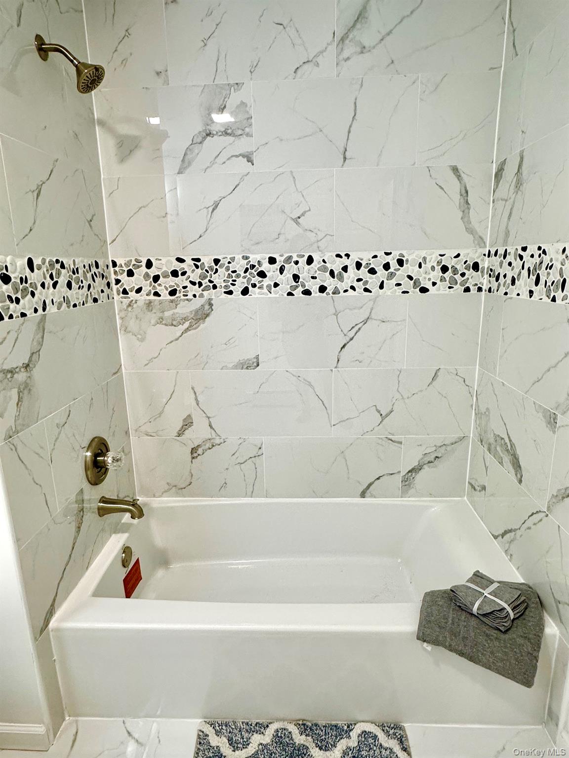 25 Clinton Street Middletown, NY 10940 - Photo 15 of 36 a bathroom with bathtub and shower