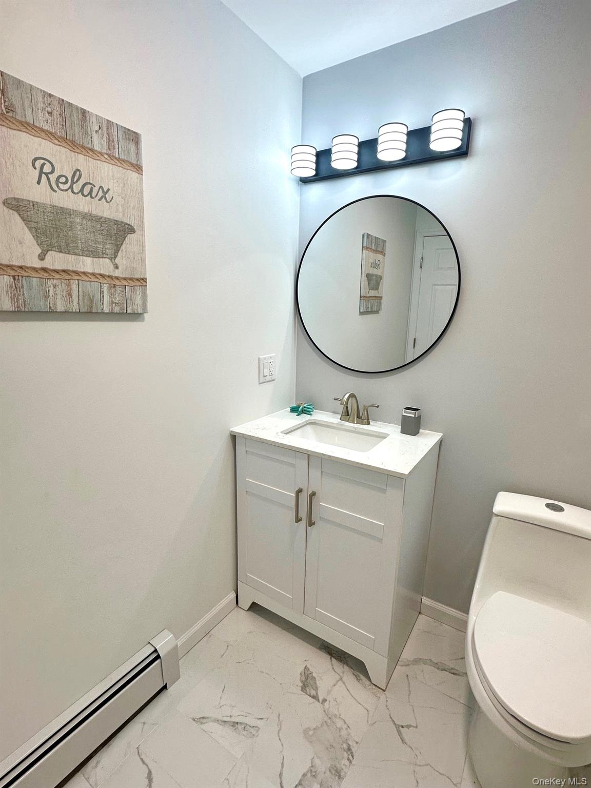 25 Clinton Street Middletown, NY 10940 - Photo 16 of 36 a bathroom with a toilet sink and mirror