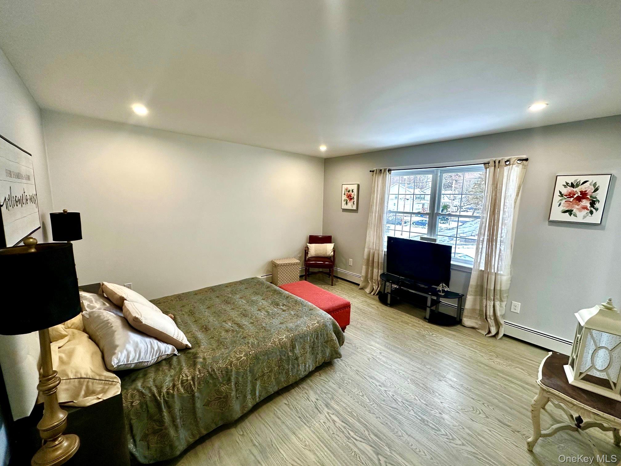 25 Clinton Street Middletown, NY 10940 - Photo 21 of 36 a bedroom with a bed and a flat screen tv