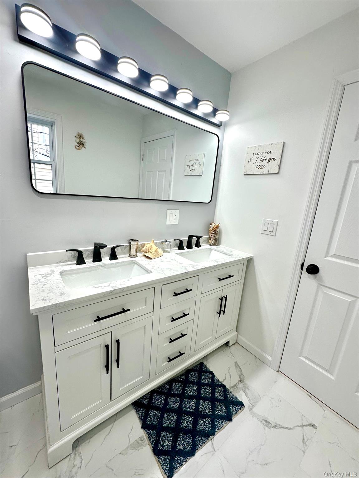 25 Clinton Street Middletown, NY 10940 - Photo 24 of 36 a bathroom with a sink a vanity and a mirror