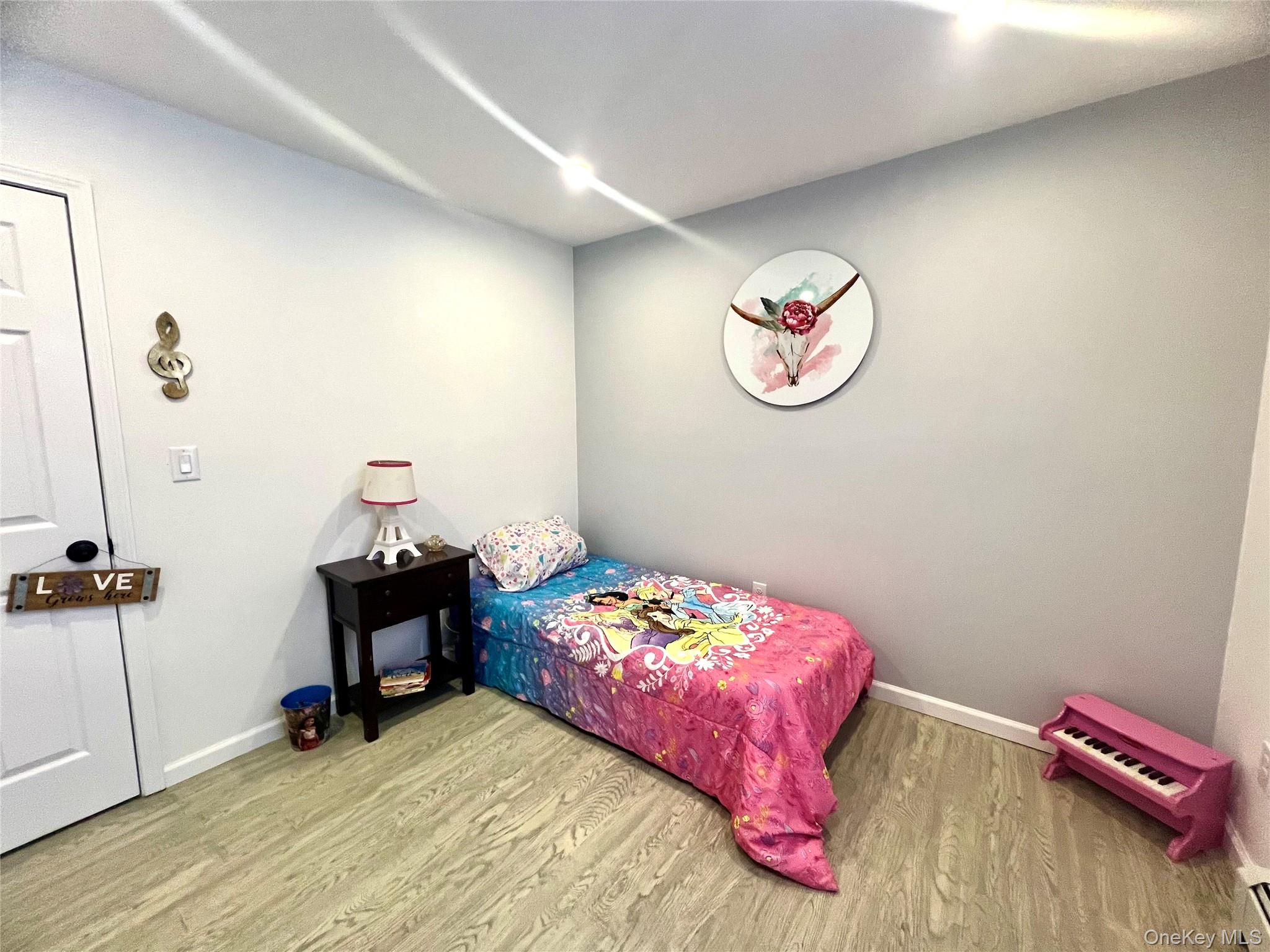 25 Clinton Street Middletown, NY 10940 - Photo 25 of 36 a bedroom with a bed and a desk