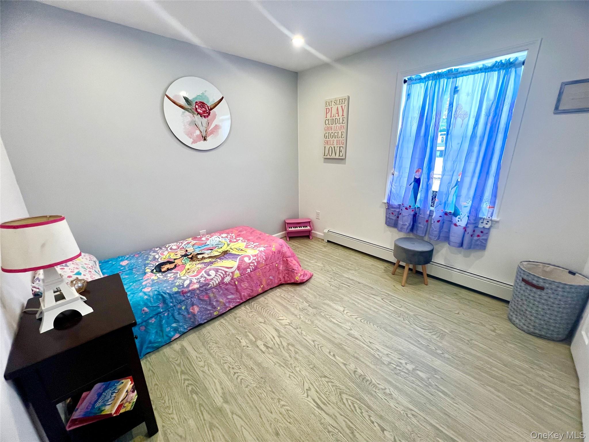 25 Clinton Street Middletown, NY 10940 - Photo 26 of 36 a bedroom with bed and a window