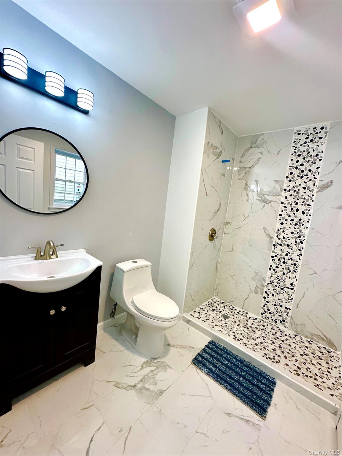 25 Clinton Street Middletown, NY 10940 - Photo 28 of 36 a bathroom with a sink toilet and shower