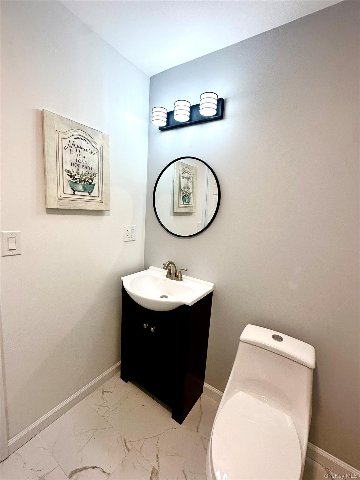 25 Clinton Street Middletown, NY 10940 - Photo 30 of 36 a bathroom with a toilet and a sink