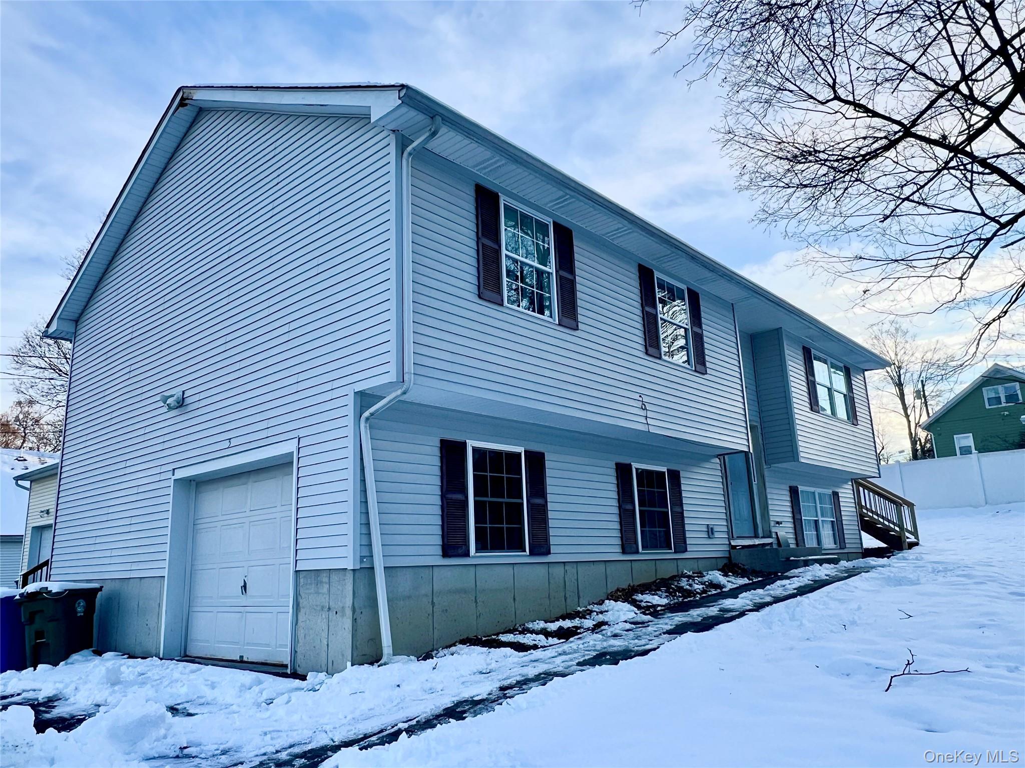 25 Clinton Street Middletown, NY 10940 - Photo 3 of 36 a front view of a house with a yard