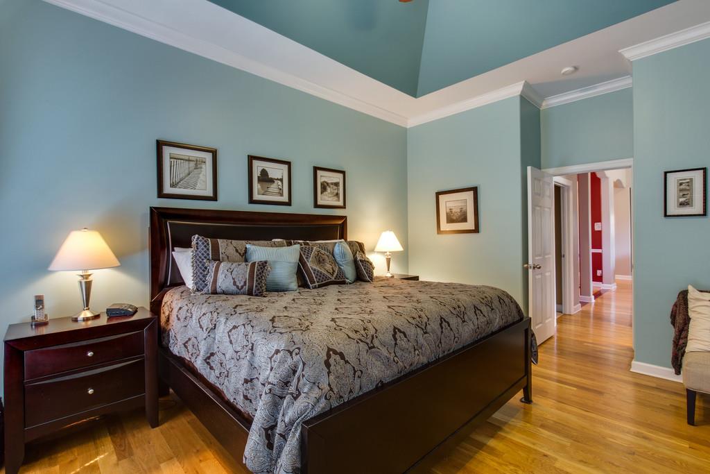 501 Sugar Flat Road Lebanon, TN 37087 - Photo 10 of 16 a bedroom with a bed and a lamp on table