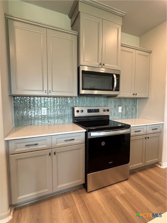837 Swallow Drive Palacios, TX 77465 - Photo 12 of 35 a kitchen with a sink and a stove top oven