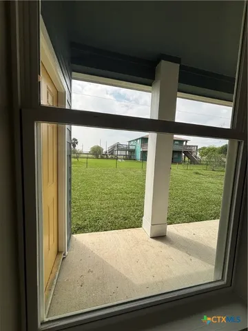 a spacious bedroom with a bed a couch and a window