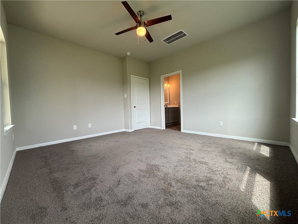837 Swallow Drive Palacios, TX 77465 - Photo 23 of 35 a view of an empty room and a ceiling fan