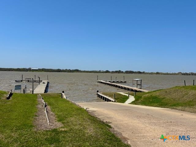 837 Swallow Drive Palacios, TX 77465 - Photo 28 of 35 a view of a lake with houses in the background