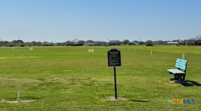 837 Swallow Drive Palacios, TX 77465 - Photo 30 of 35 a view of a lake with a yard and large trees